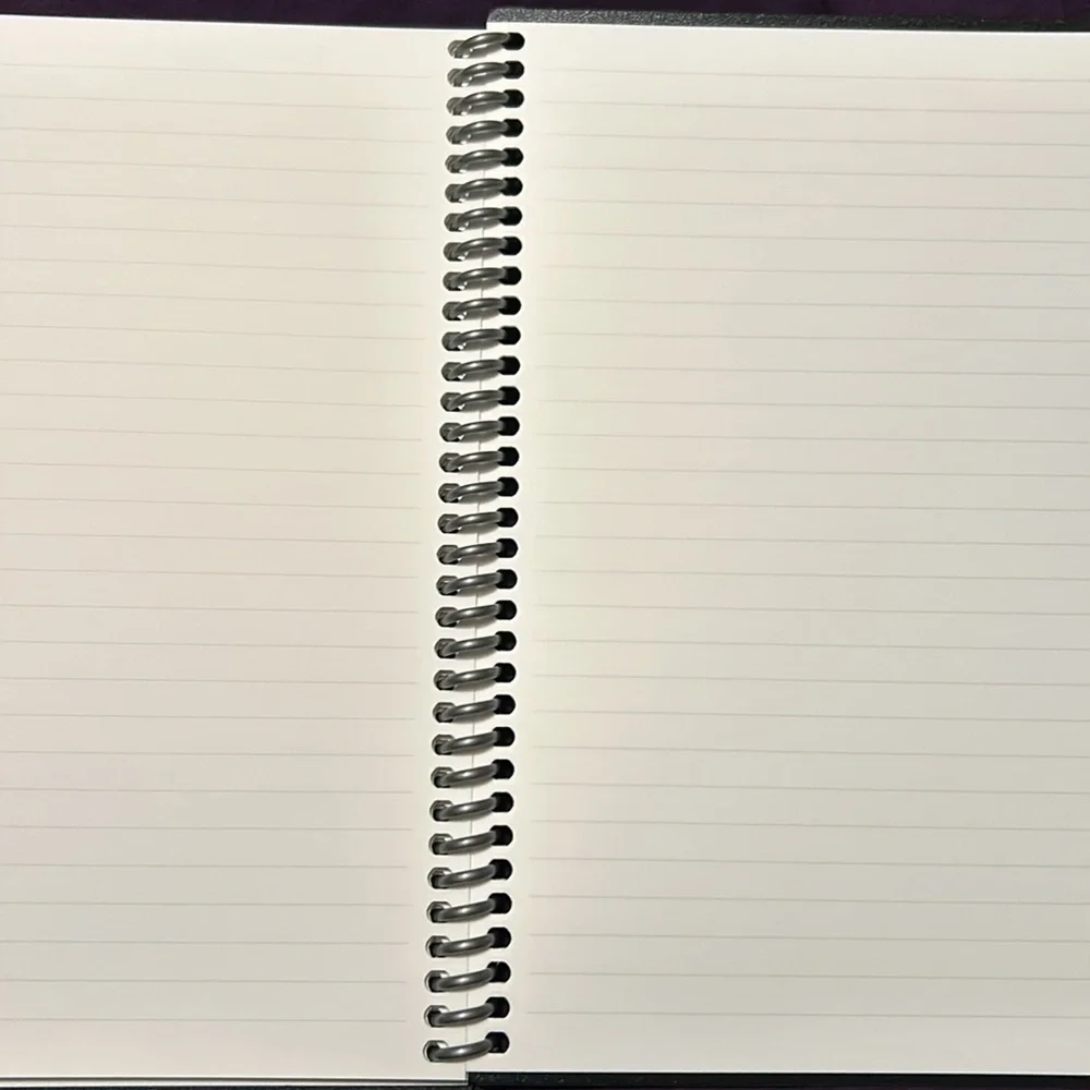 Smart book planner includes pen and cleaning cloth